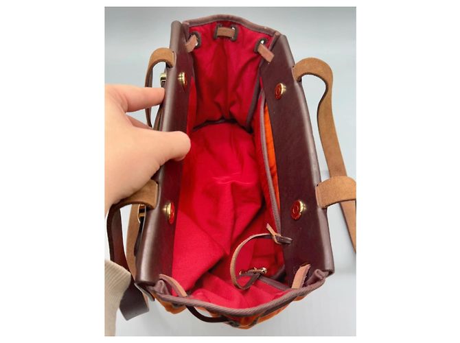 Hermès La sua borsa a spalla in pelle e tela arancione Marrone - vista 18