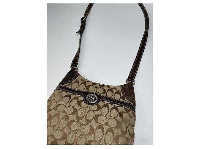 Bolsa de mão de couro bege Sufflette Signature da Coach - vista 4