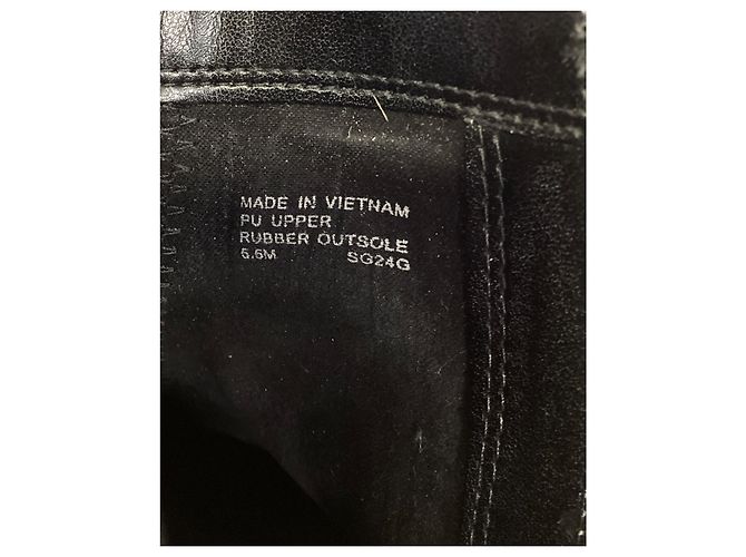 Bota flat Britt da Michael Kors em couro preto - vista 15