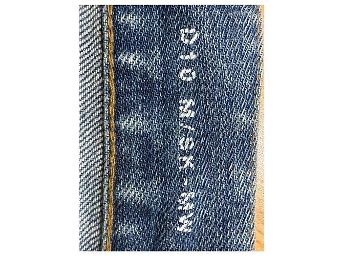 Jeans slim desbotado e rasgado em denim azul da Saint Laurent - vista 10