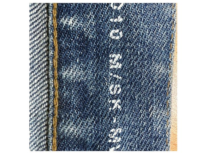 Jeans slim desbotado e rasgado em denim azul da Saint Laurent - vista 5