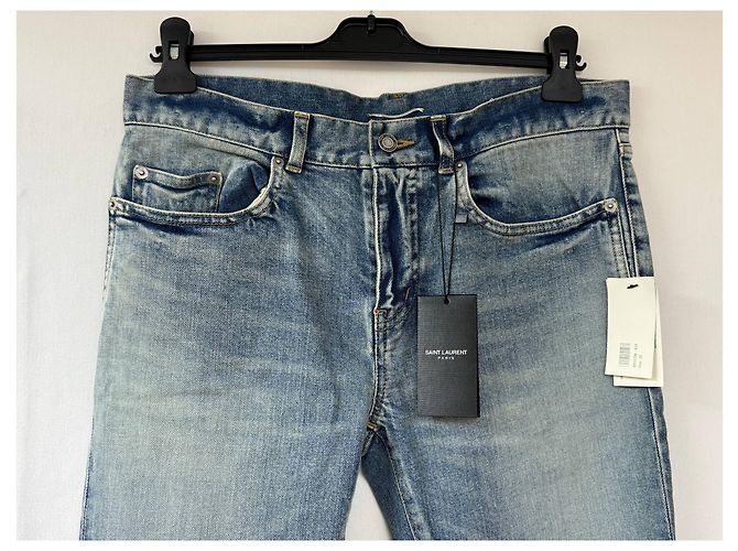 Jeans slim desbotado e rasgado em denim azul da Saint Laurent - vista 7