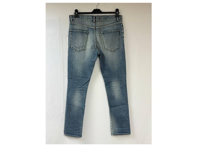 Jeans slim desbotado e rasgado em denim azul da Saint Laurent - vista 8