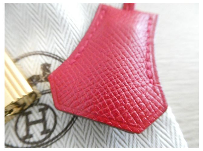 campana, cremallera y candado Hermès en acero dorado con bolsa de polvo para Kelly, Birkin Roja Gold hardware - vista 2