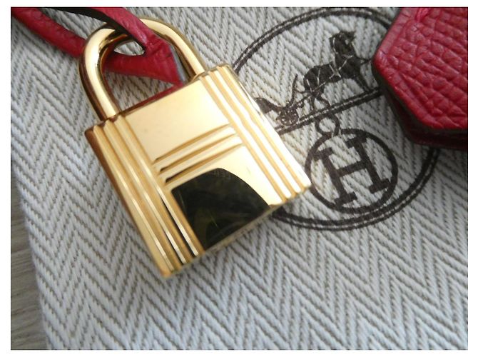 campana, cremallera y candado Hermès en acero dorado con bolsa de polvo para Kelly, Birkin Roja Gold hardware - vista 6