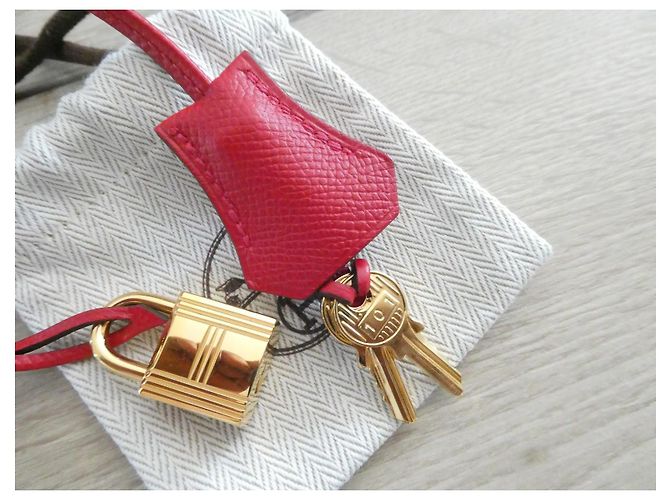 campana, cremallera y candado Hermès en acero dorado con bolsa de polvo para Kelly, Birkin Roja Gold hardware - vista 7