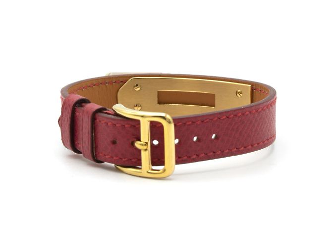 Hermès Kelly Uhr.- Einzelnes rotes Lederarmband mit Hermès-Unterschrift. Golden - Ansicht 3
