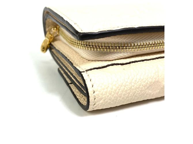 Billetera Tri-Fold Monogram Empreinte Louis Vuitton - vista 6