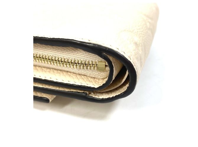 Billetera Tri-Fold Monogram Empreinte Louis Vuitton - vista 7