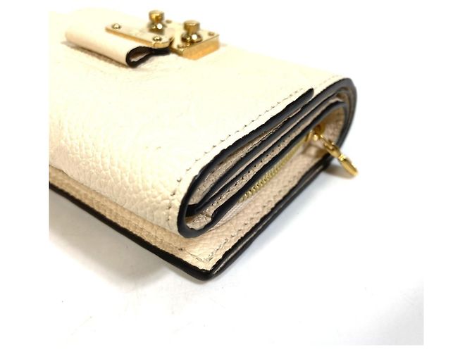 Billetera Tri-Fold Monogram Empreinte Louis Vuitton - vista 8