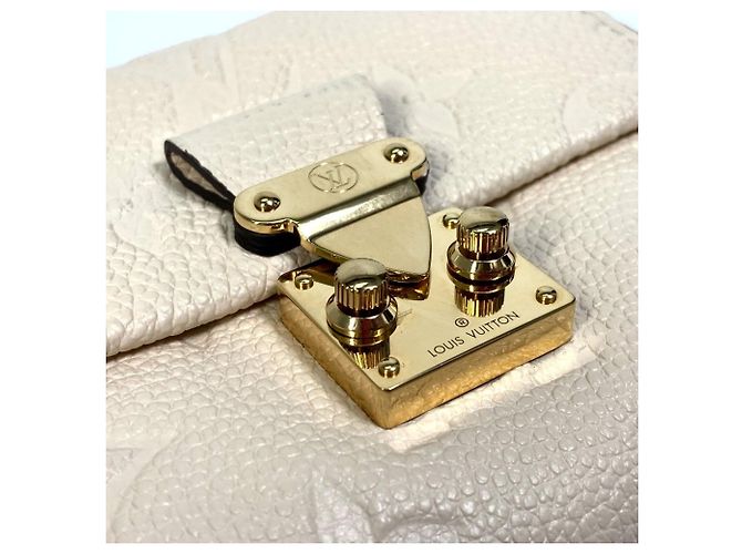 Billetera Tri-Fold Monogram Empreinte Louis Vuitton - vista 9