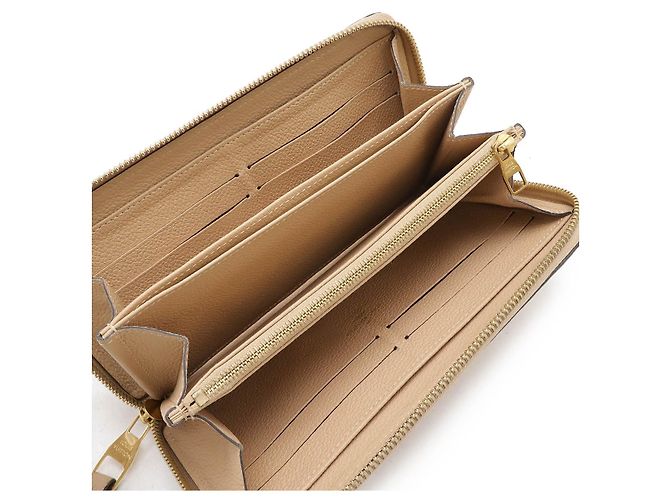 Portafoglio Zippy Monogram Empreinte Louis Vuitton Marrone Beige - vista 5