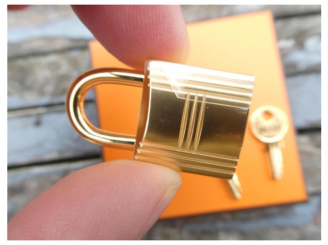 nuovo lucchetto Hermès dorato per borse Hermès Kelly, Birkin, ecc... Gold hardware - vista 2
