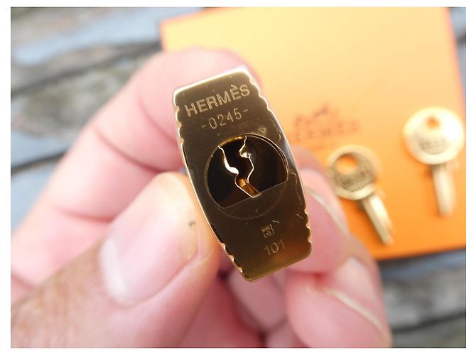 nuovo lucchetto Hermès dorato per borse Hermès Kelly, Birkin, ecc... Gold hardware - vista 5
