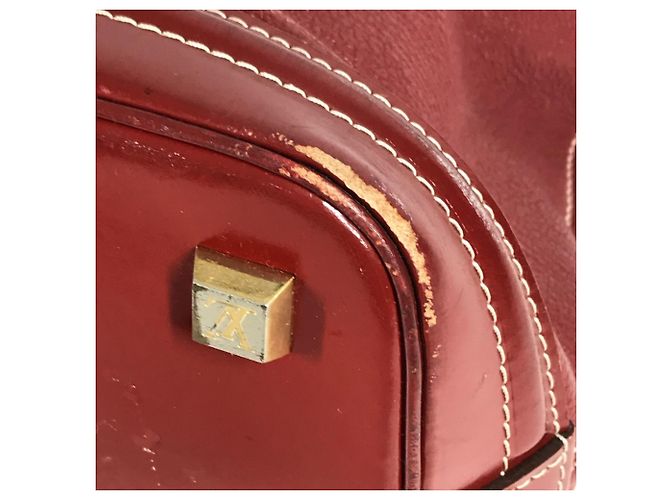 Borsa Tote Louis Vuitton Suhali Lockit MM in Rosso Tanami - vista 9