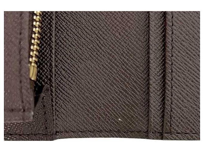 Brazza Billetera Larga Bifold Louis Vuitton en Damier Ebene Marrón Castaño - vista 11