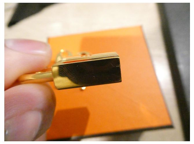 Chiusura Hermès in acciaio dorato per borse Hermès Birkin e Kelly, micro graffi Gold hardware - vista 7