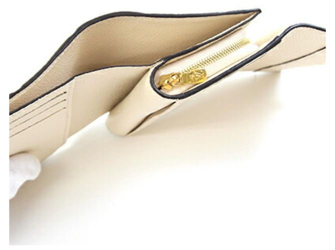 Portafoglio Metis Compact Tri-fold in Monogram Empreinte Louis Vuitton Crudo - vista 3