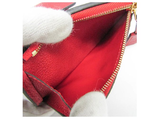 Billetera Compacta Pont Neuf Monogram Empreinte Louis Vuitton Roja Fucsia - vista 4