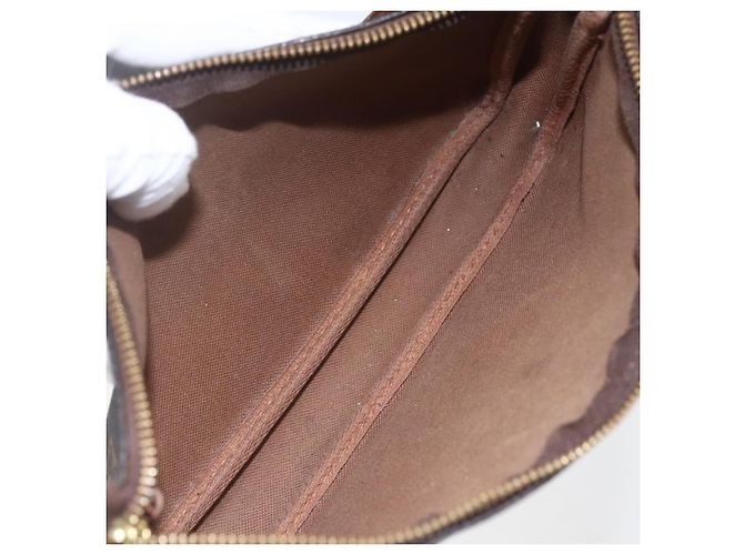 Pochette Accessoires NM en lona Monogram Louis Vuitton Castaño - vista 5