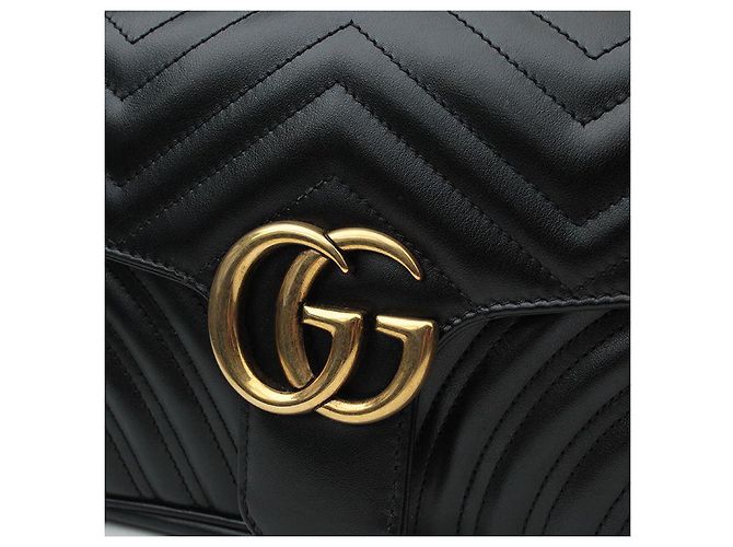 Gucci Borsa a tracolla matelassé nera Marmont GG dorata Nero - vista 6