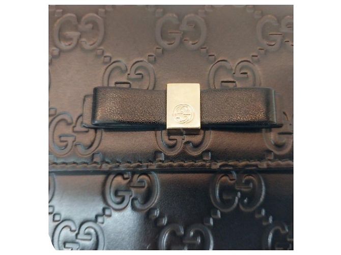 Gucci Billetera compacta de cuero Sima negra con lazo de cinta dorada y firma Negro - vista 5