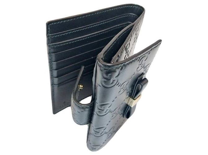 Gucci Billetera compacta de cuero Sima negra con lazo de cinta dorada y firma Negro - vista 7