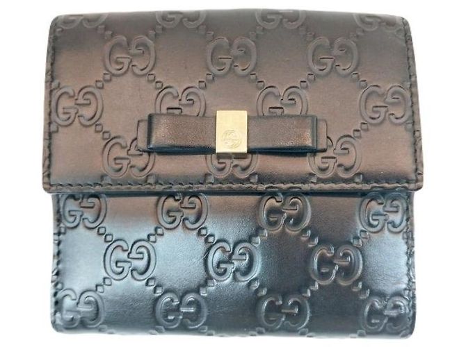 Gucci Billetera compacta de cuero Sima negra con lazo de cinta dorada y firma Negro - vista 9