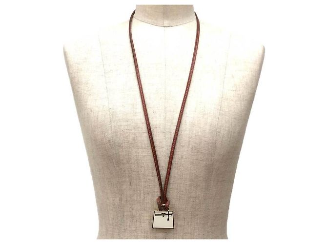 Pendente Charm Hermès Top Curiosity Kelly Bianco x Oro - vista 2
