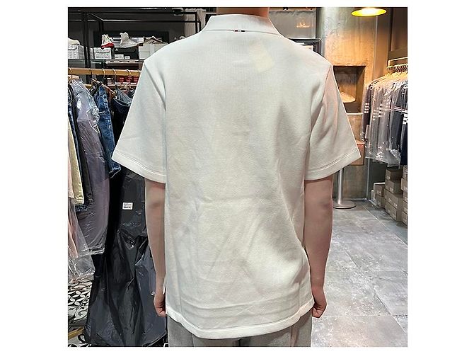 Thom Browne Polo a maniche corte in interlock con tasca e tre righe bianche Bianco - vista 24