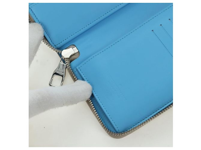 Cartera Vertical Zippy Taurillon Climbing Louis Vuitton Marfil M81573 Auth 172432SAM Crudo - vista 21