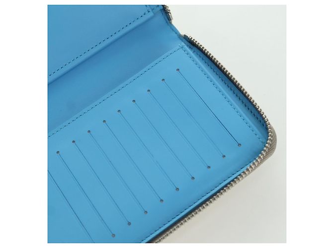 Cartera Vertical Zippy Taurillon Climbing Louis Vuitton Marfil M81573 Auth 172432SAM Crudo - vista 22