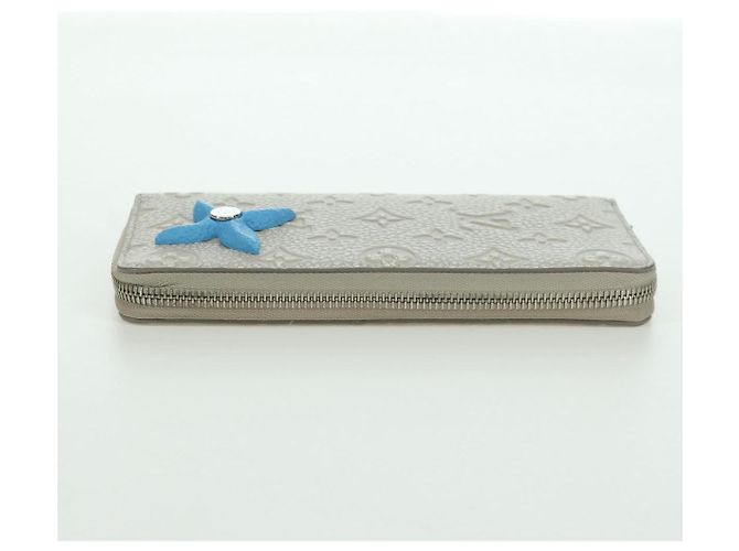 Cartera Vertical Zippy Taurillon Climbing Louis Vuitton Marfil M81573 Auth 172432SAM Crudo - vista 3