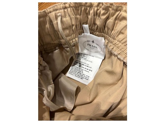 Calça larga de algodão bege com placa de logo Prada - vista 6