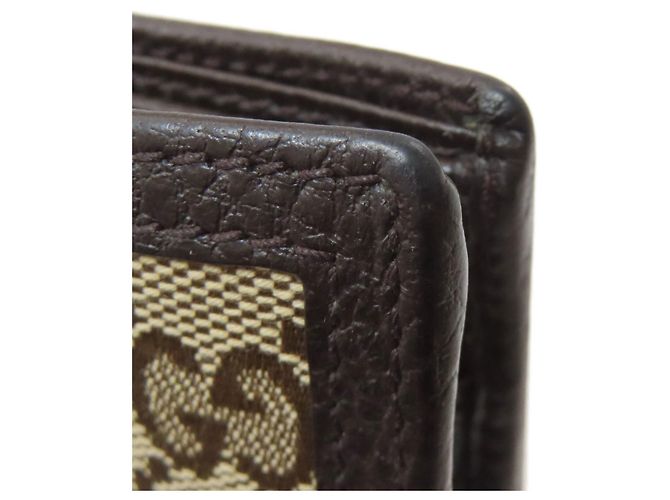 Portafoglio bi-fold Gucci in tela e pelle marrone - vista 17