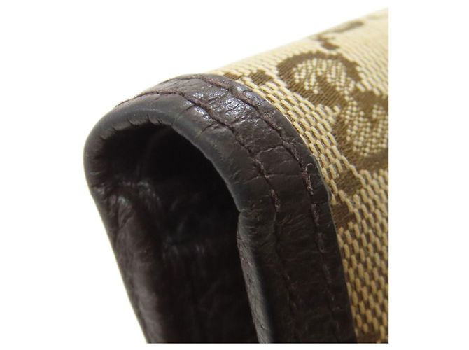 Portafoglio bi-fold Gucci in tela e pelle marrone - vista 19