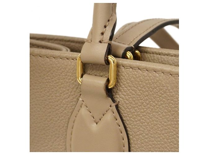 Borsa tote OnTheGo MM in Monogram Empreinte Louis Vuitton Beige - vista 9