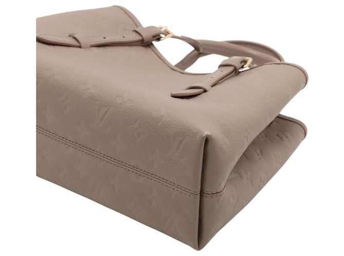 Borsa Tote Babylone PM in Monogram Empreinte beige di Louis Vuitton - vista 4