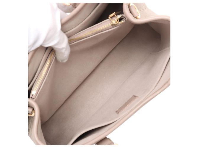 Borsa Tote Babylone PM in Monogram Empreinte beige di Louis Vuitton - vista 5