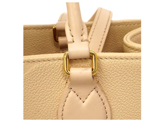 Borsa tote OnTheGo MM in Monogram Empreinte di Louis Vuitton Crudo - vista 11