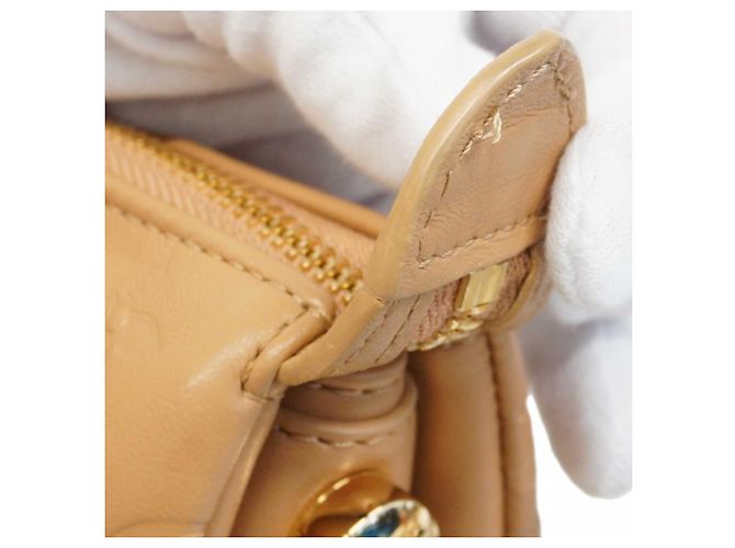 Borsa a mano Coussin PM in pelle Monogram goffrata Louis Vuitton Cammello - vista 8