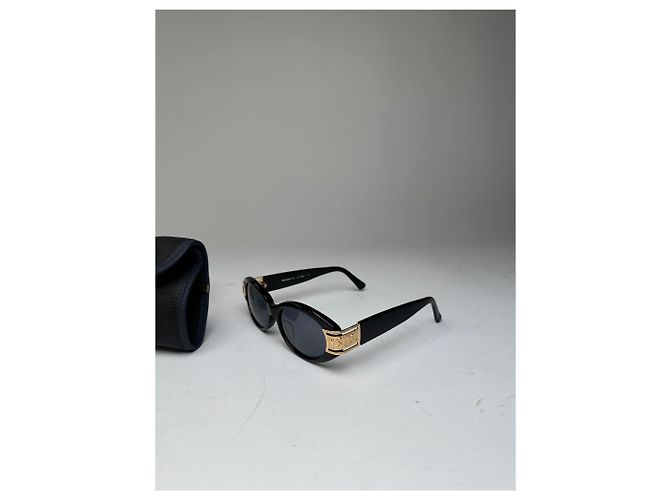 Lunettes de soleil vintage Yves Saint Laurent noires et dorées avec logo YSL - vue 7