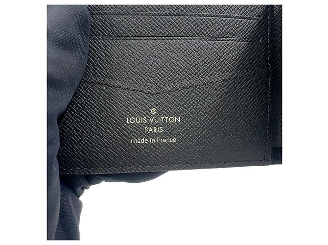 Louis Vuitton Pre-owned Portafoglio Slender in PVC Grigio - vista 4
