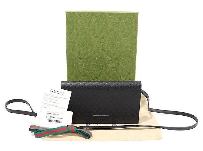 Clutch a tracolla in pelle micro Guccissima con logo GG nero - vista 2