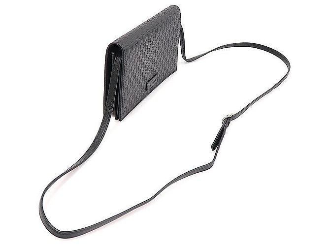 Clutch a tracolla in pelle micro Guccissima con logo GG nero - vista 3