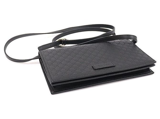 Clutch a tracolla in pelle micro Guccissima con logo GG nero - vista 5