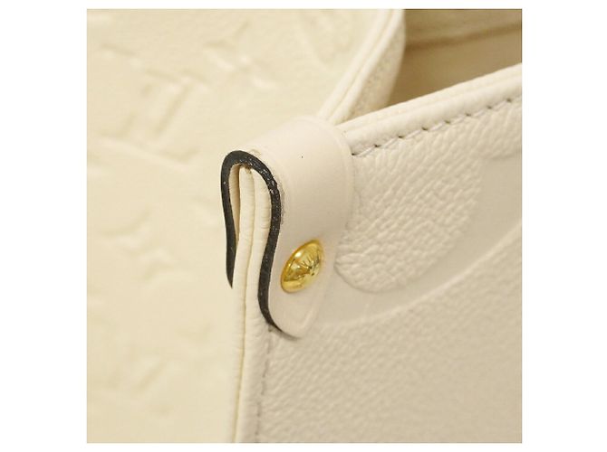 Borsa Tote Louis Vuitton Monogram Empreinte OnTheGo MM Crudo - vista 6