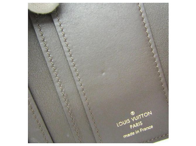 Carteira Louis Vuitton Taurillon Capucines XS Bege - vista 14