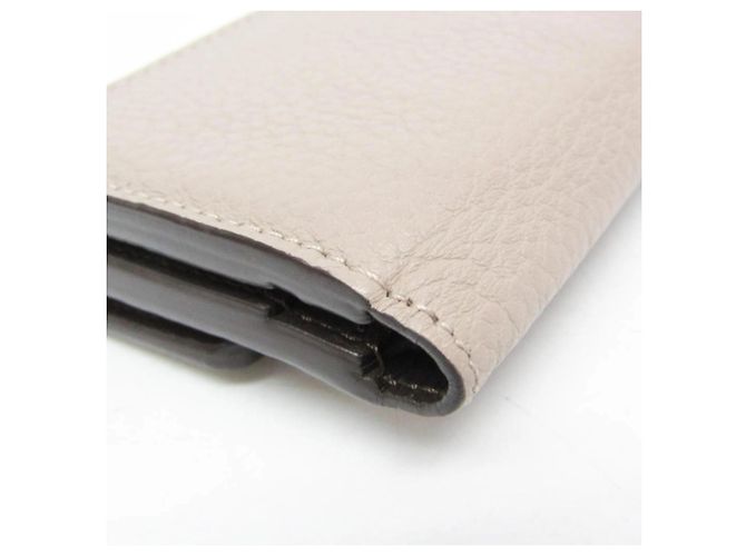 Carteira Louis Vuitton Taurillon Capucines XS Bege - vista 8