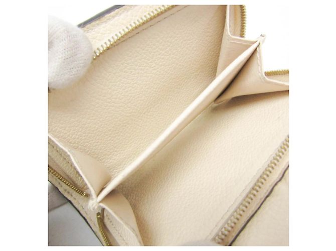Cartera Compacta Louis Vuitton Monogram Empreinte Métis Crudo Blanco roto - vista 4